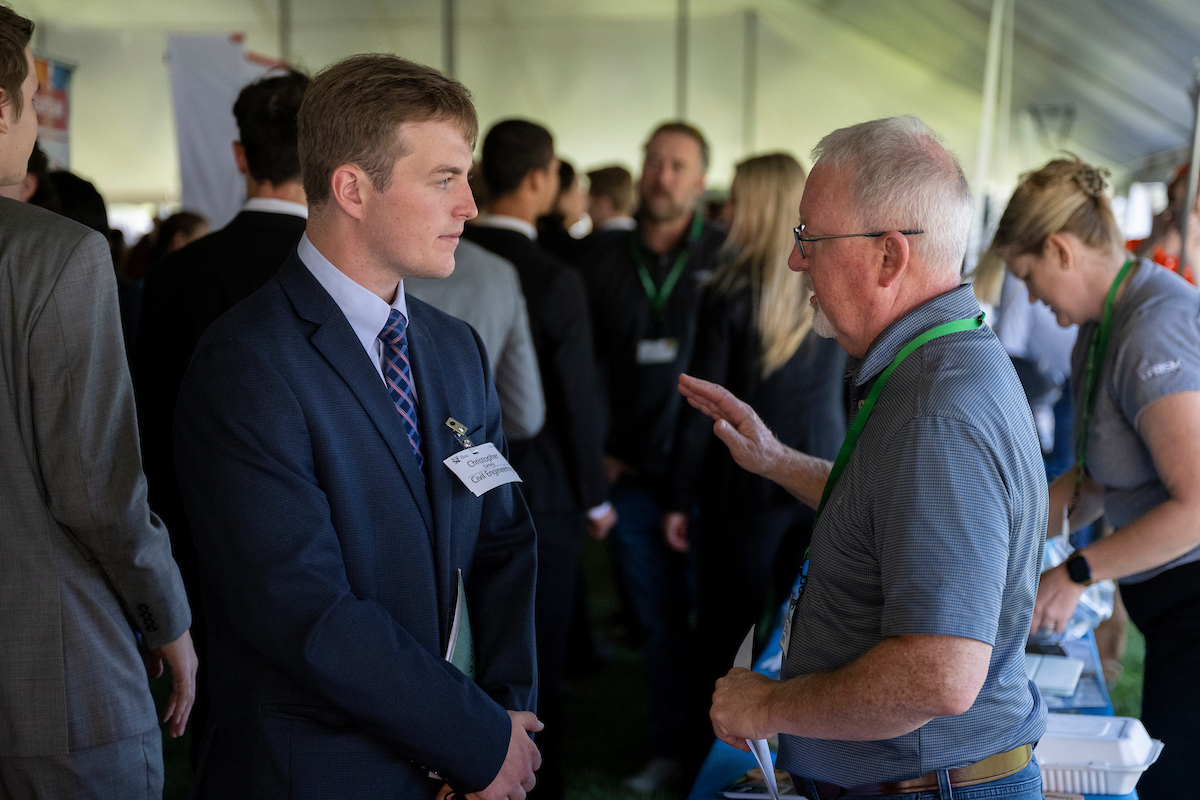 Students talking to employers at the career fair